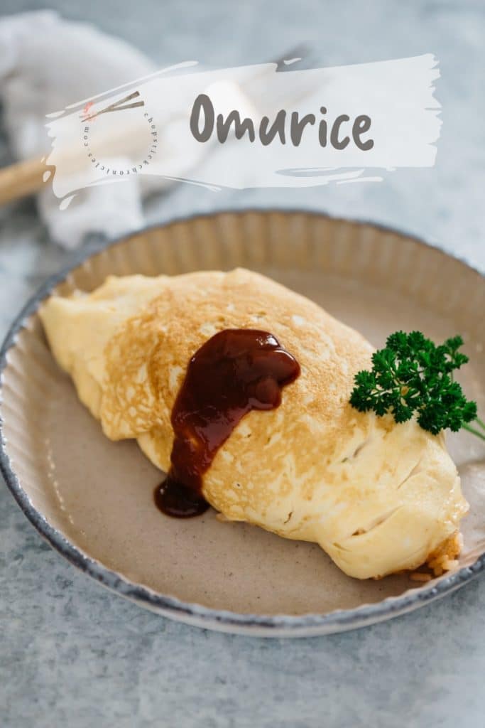 #Omurice served on a round plate with tomato sauce drizzling on the side