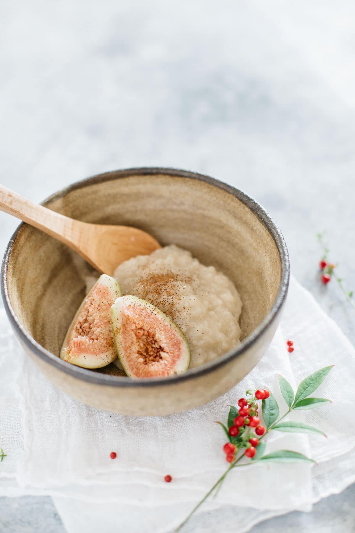 Amazake served in a small bowl with slices of fig