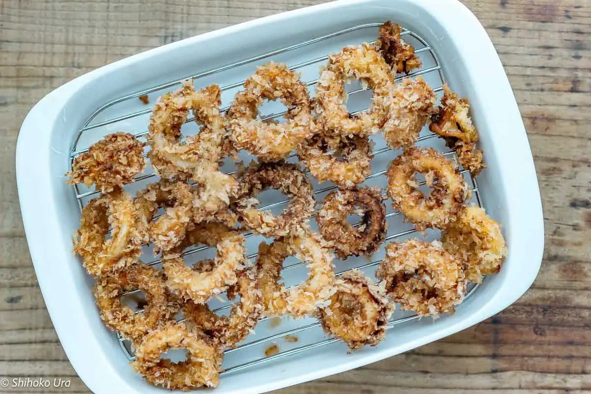 Remove and place on a wire rack or paper towel to drain excess oil