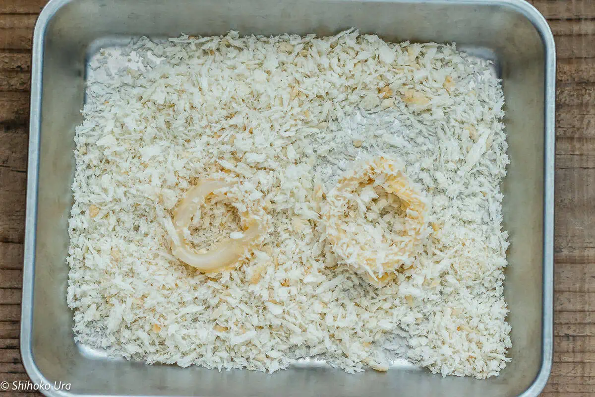 Dip the squid tubes into the batter, then coat with panko for extra crunch.