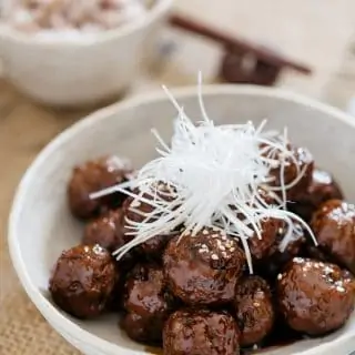 Teriyaki meatballs served in a Japanese pottery shallow bowl