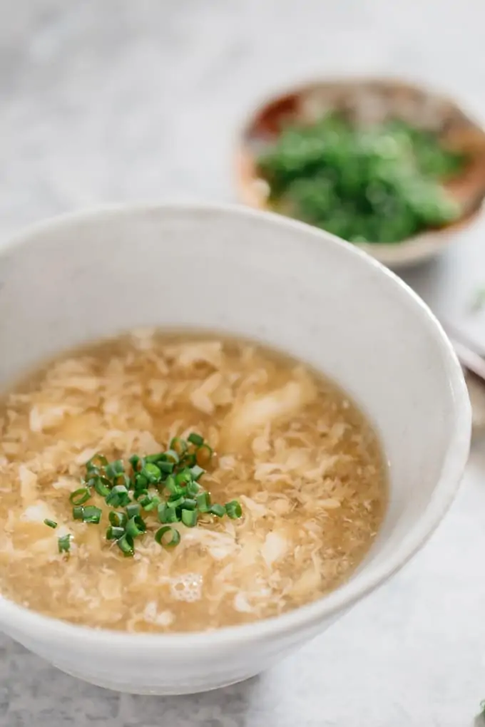 egg drop soup served in a large Japanese pottery bowl