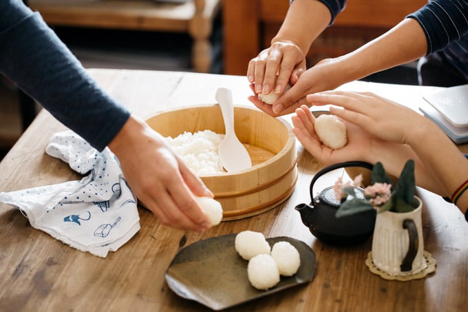 Family gathering and making sushi rice balls together
