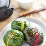 three swiss chard Mehari Zushi served on an oval plate