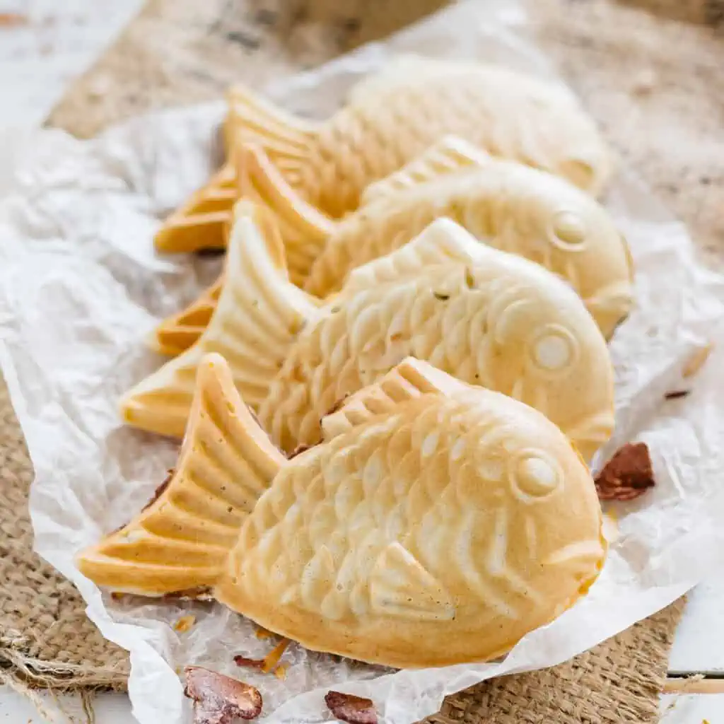 three taiyaki Japanese sweet waffles on a wrapping paper