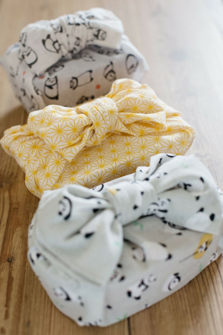 three bento boxes wrapped up with Japanese hand towel