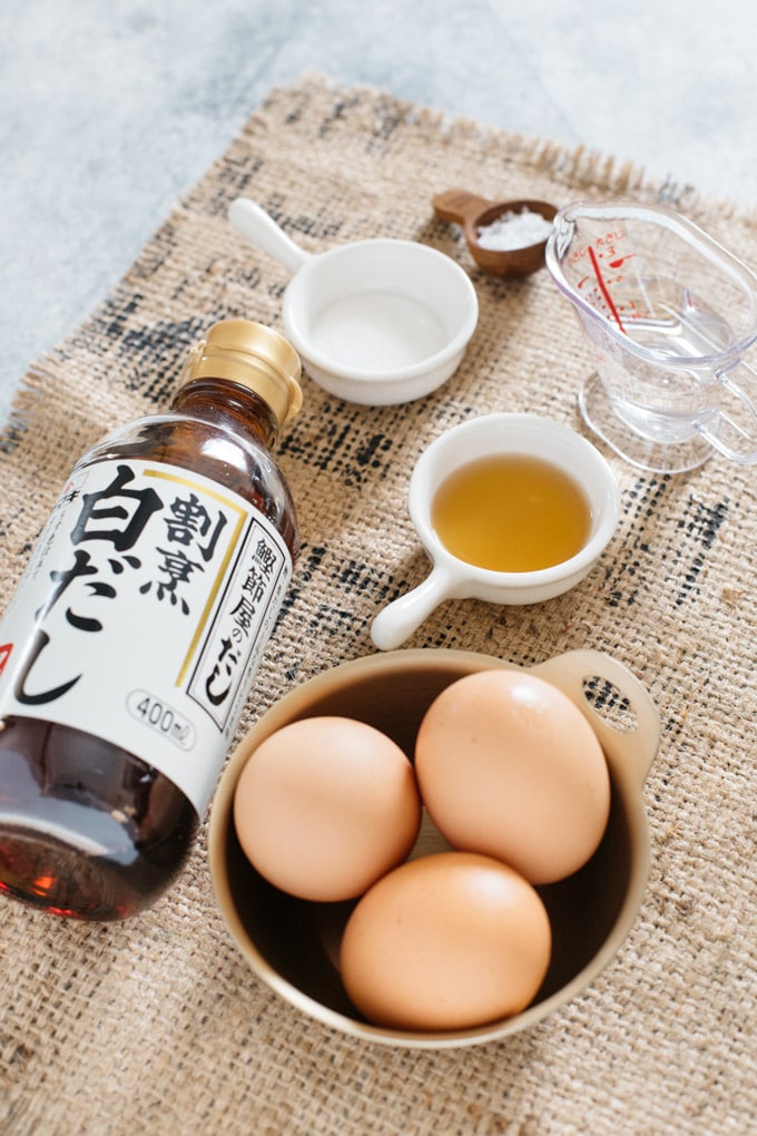 tamagoyaki ingredients- three eggs, shirodashi, sugar, salt and water