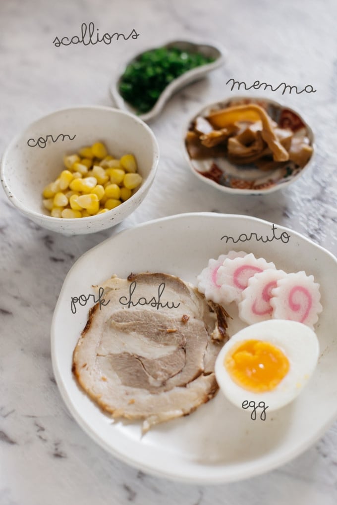 Shoyu ramen ingredients-pork, naruoto, egg, corn, bamboo shoots, scallions