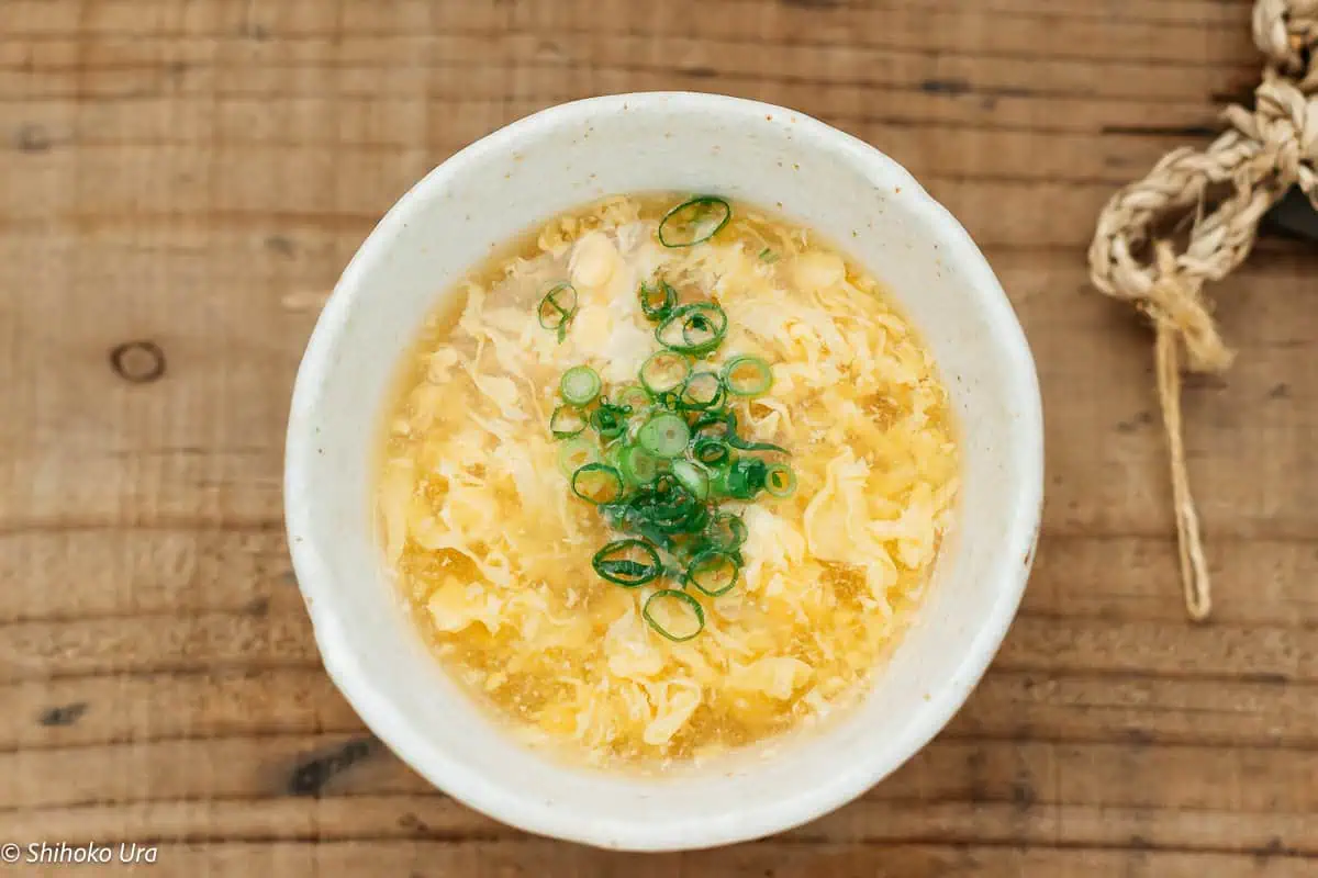 egg drop soup served into a bowl and garnished with green onions