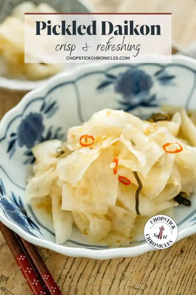 Traditional pickled daikon radish in a blue and white bowl.