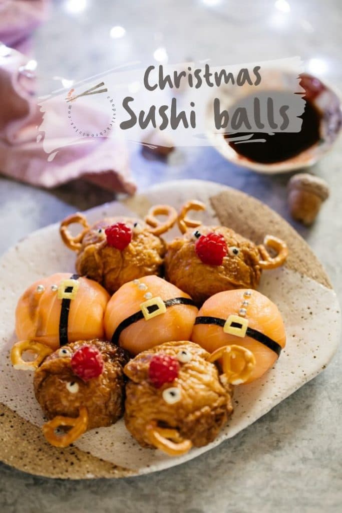 Three Santa sushi balls and four reindeer sushi balls on a plate