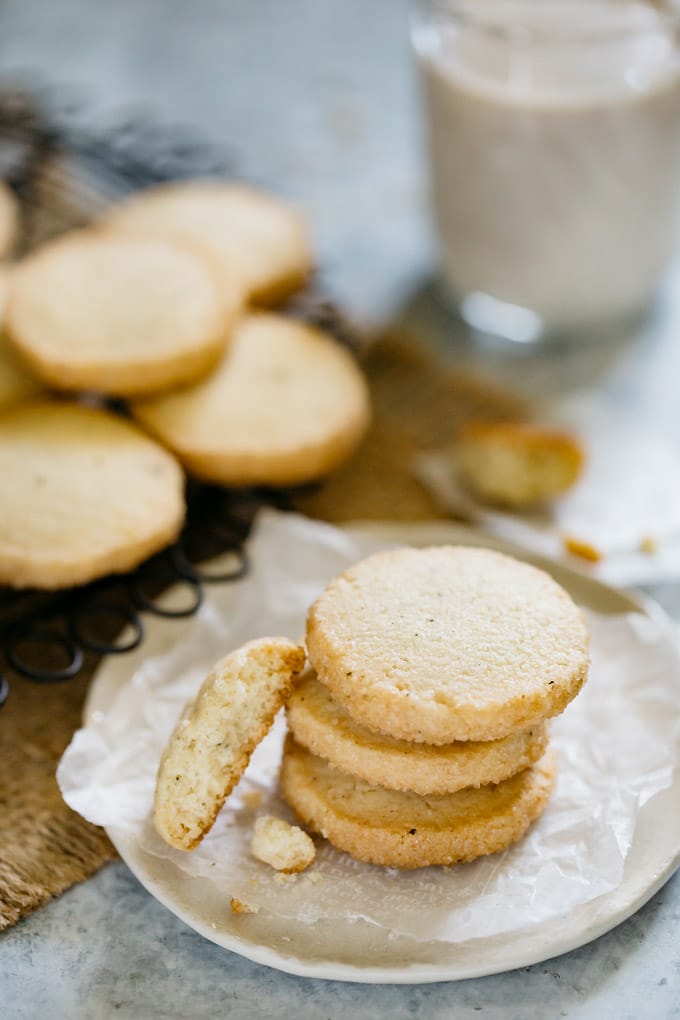 three icebox butter cookies stacked up on a round plate