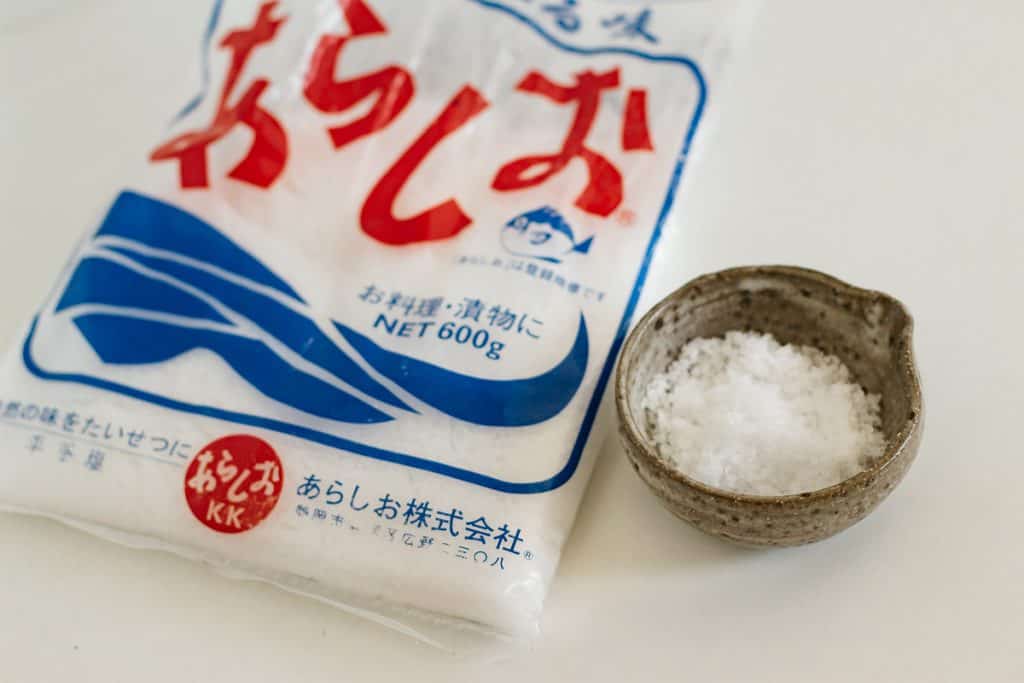 salt package from Japan on the left and salt in a small bowl on the right