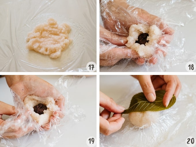spread pink coloured rice on cling wrap, an anko ball placed on top of rice and covered with rice and sakura leave