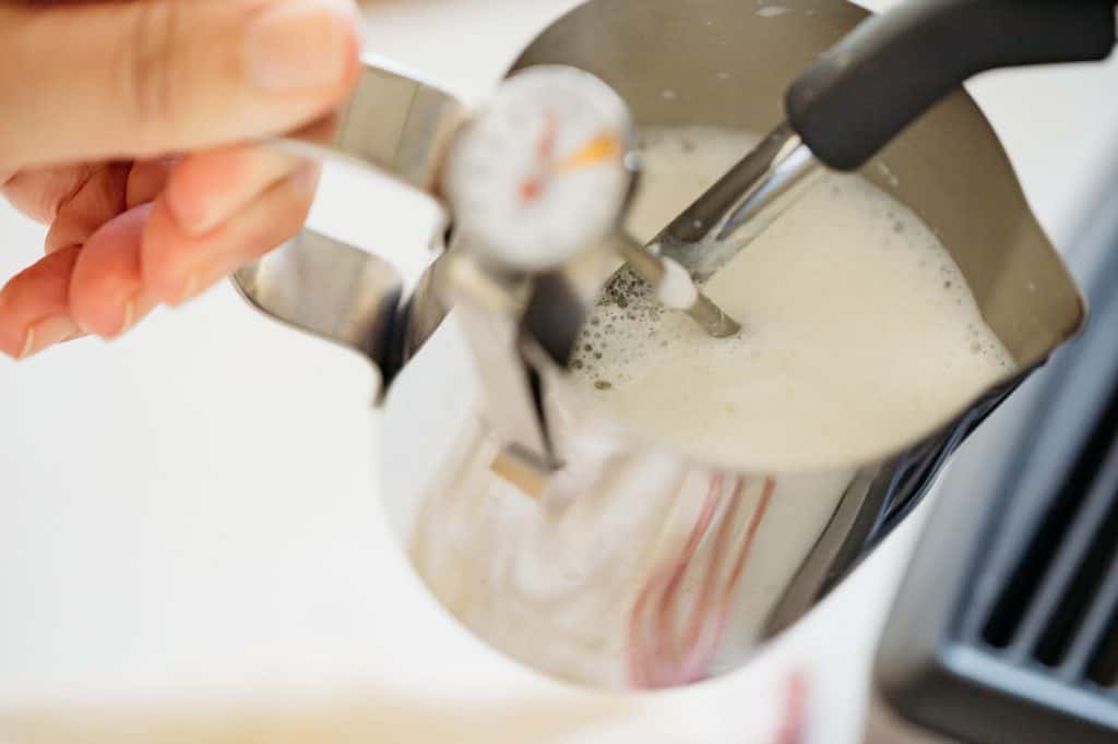 frothing milk with cofee espresso machine