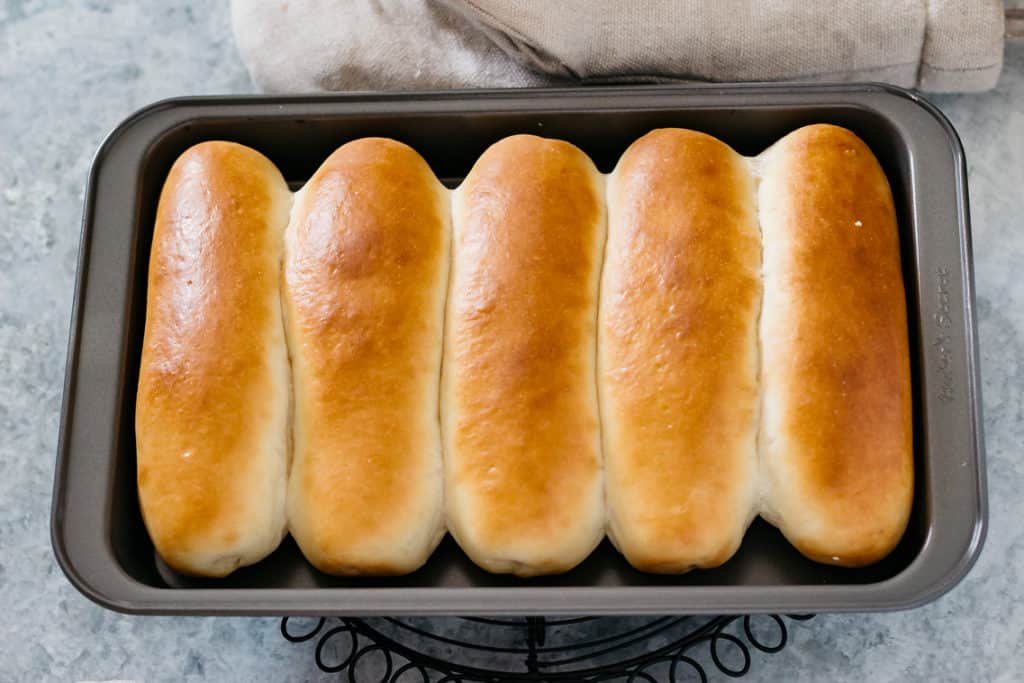5 New england style hot dog buns in a mould 