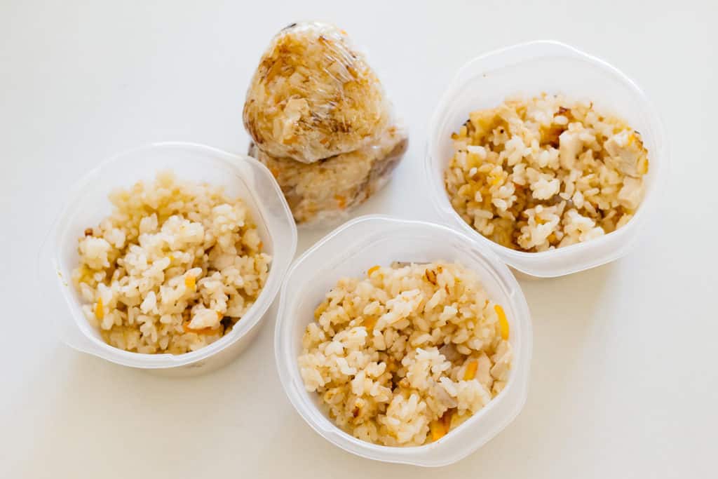 seasoned rice in three small container and made into a rice ball.