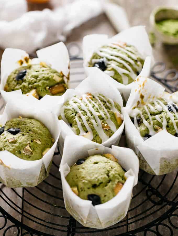 6 matcha muffins on a black cooling wire rack