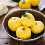 4 yuzu citrus fruits in a shallow bowl