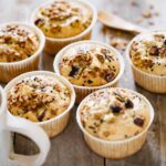 6 sweet potato and granola cake on a table with a coffee mug