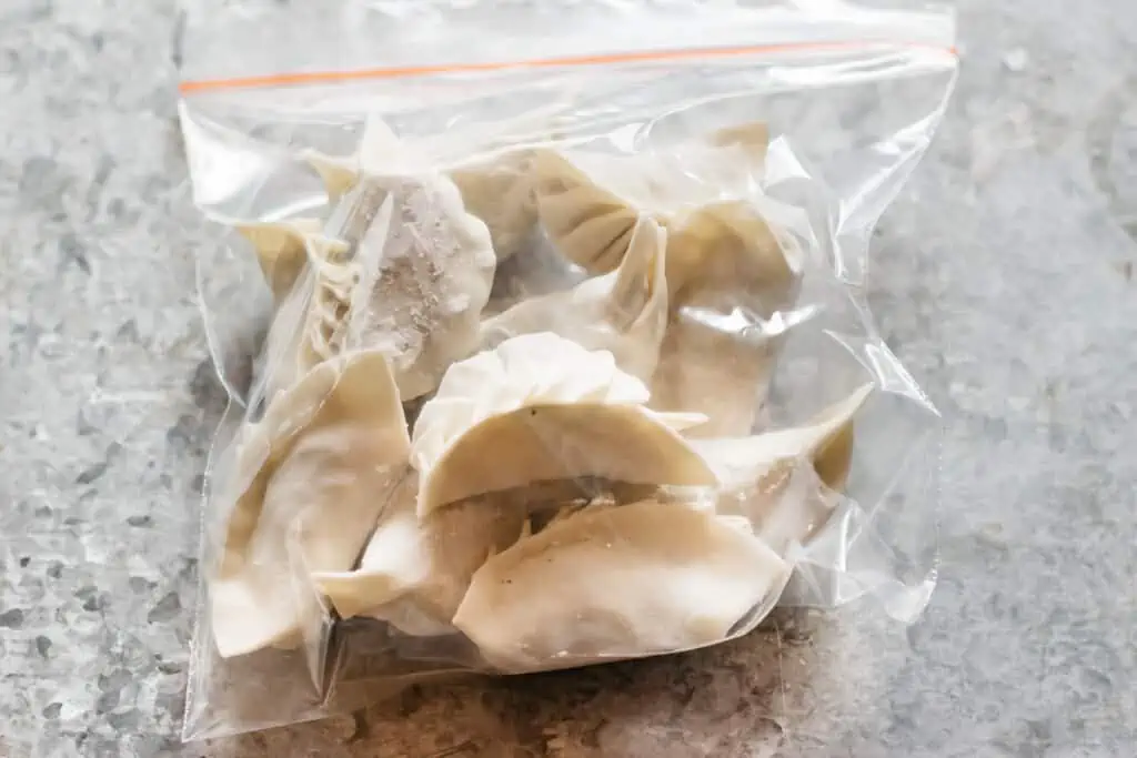 individually frozen vegetable gyoza dumplings in a ziplock bag
