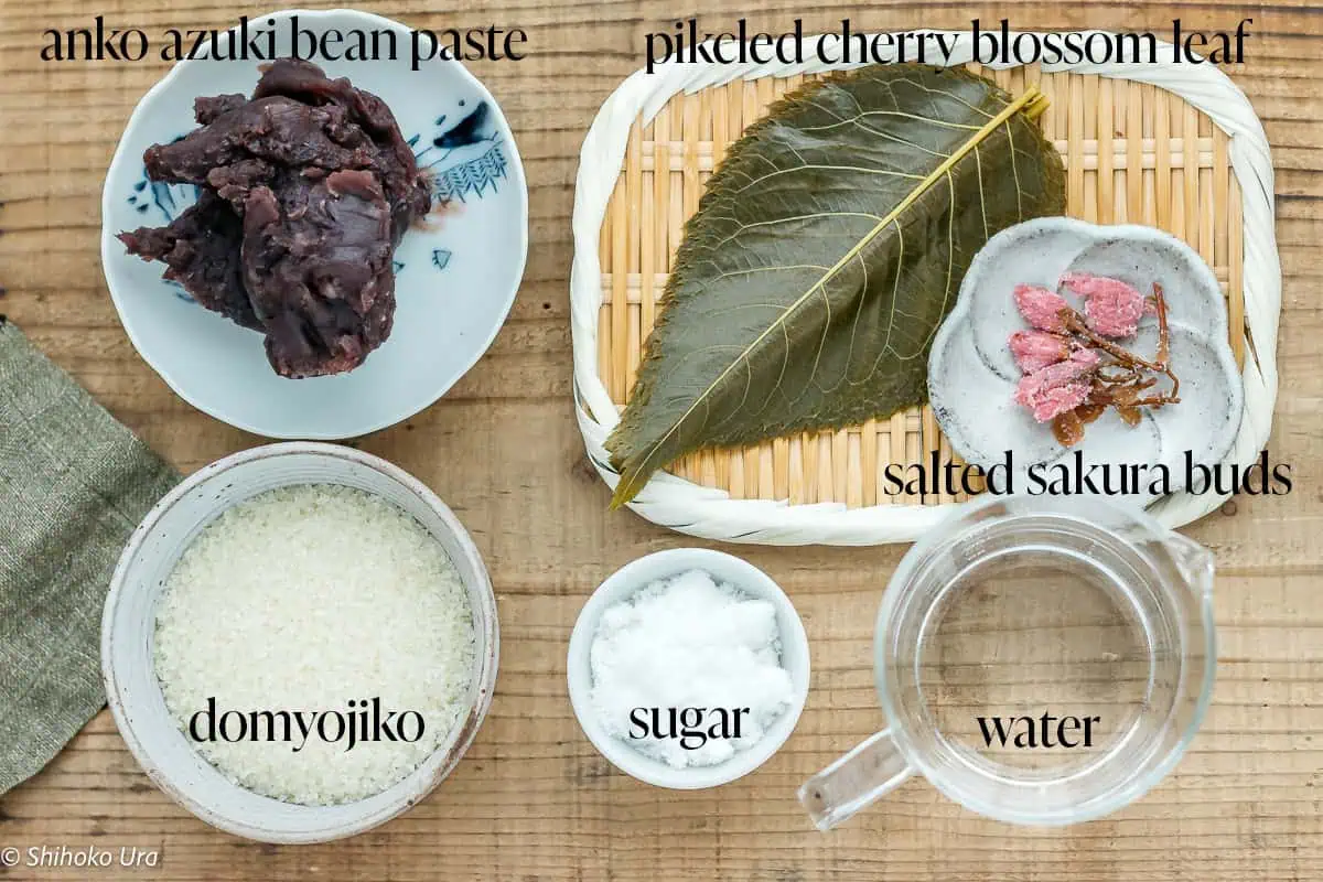 azuki bean paste, domyojiko, pickled cherry blossom leaf, aslted sukura buds, sugar and water on a kitchen bench