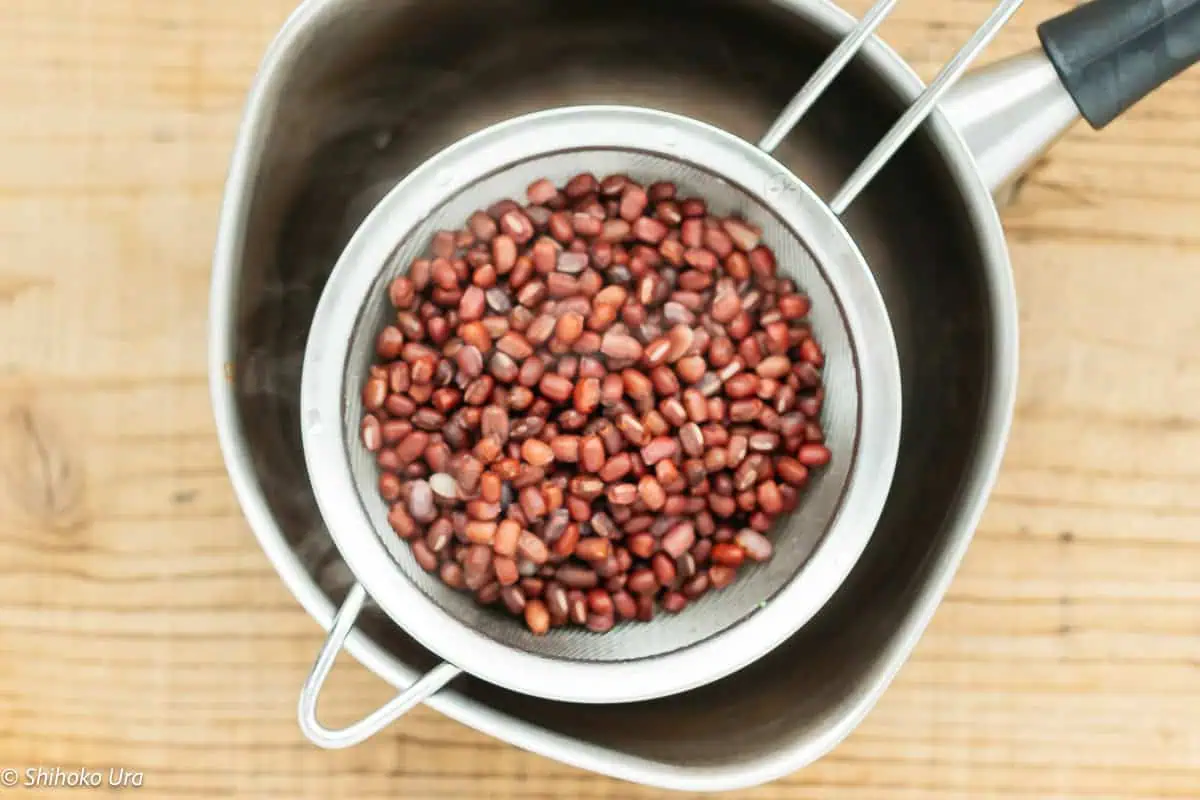 azukibeans drained using a seive over a saucepan